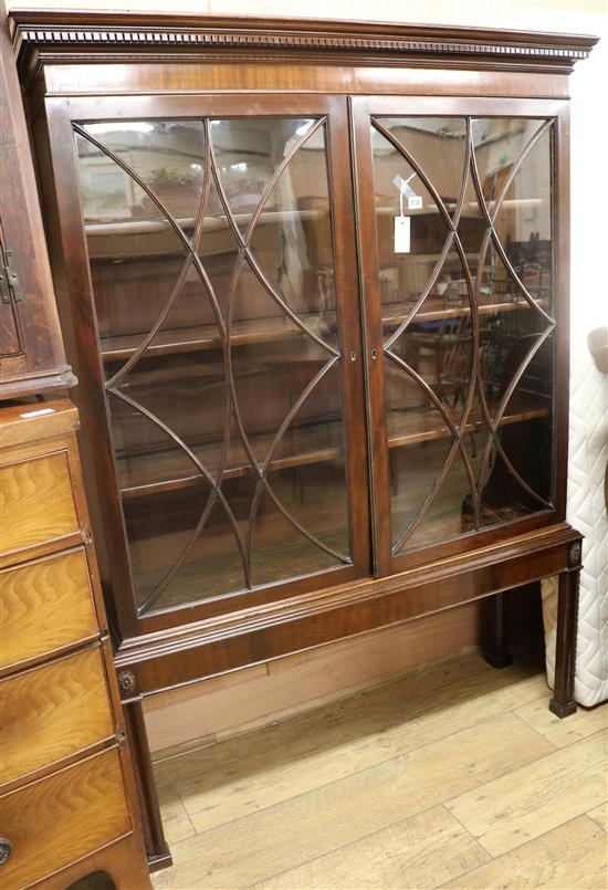 A Georgian style mahogany bookcase on stand W.121cm H.169cm